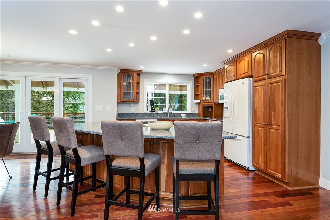 17325 3rd Avenue Southeast Bothell, WA 98012 - Photo 10 of 40 a view of a dining room with furniture window and wooden floor