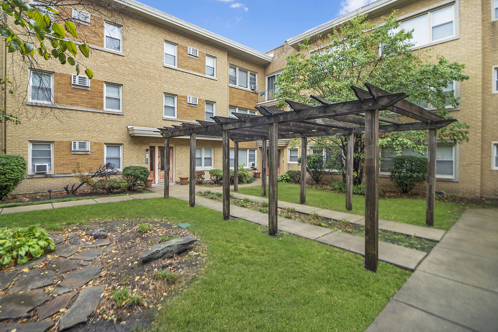 1951 Euclid Avenue, Unit 202 Berwyn, IL 60402 - Photo 2 of 16 a view of a house with a yard and sitting area