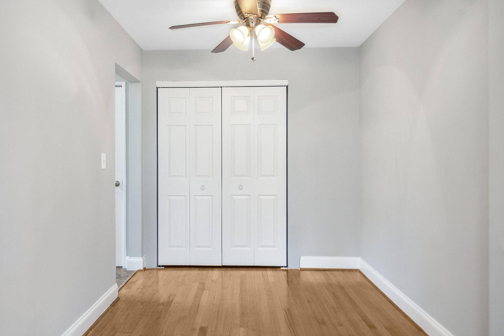1951 Euclid Avenue, Unit 202 Berwyn, IL 60402 - Photo 12 of 16 a view of an empty room with wooden floor