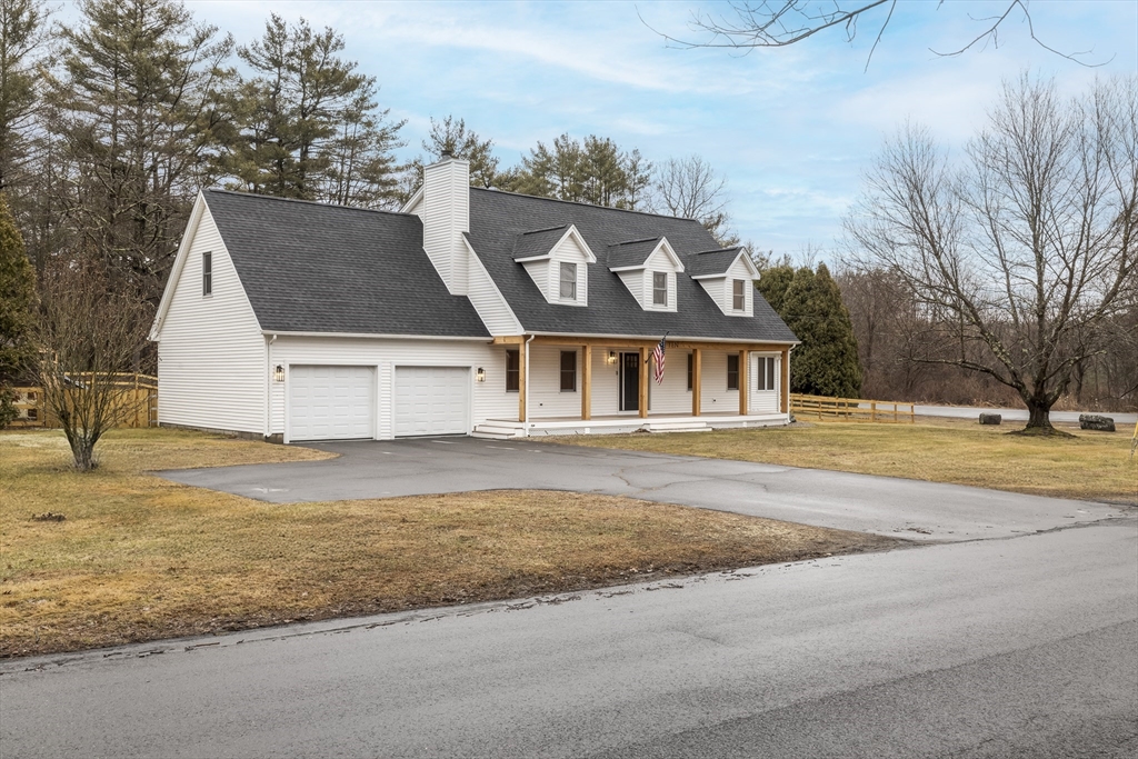 10 Alden Street Ludlow, MA 01056 - Photo 1 of 41 a front view of a house with a yard and garage