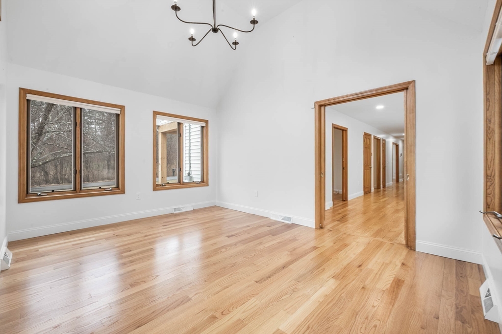 10 Alden Street Ludlow, MA 01056 - Photo 11 of 41 a view of an empty room with wooden floor and a window