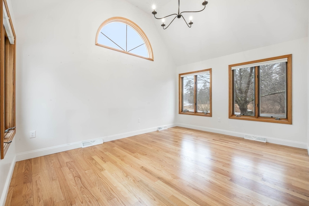 10 Alden Street Ludlow, MA 01056 - Photo 12 of 41 a view of an empty room with wooden floor and a window