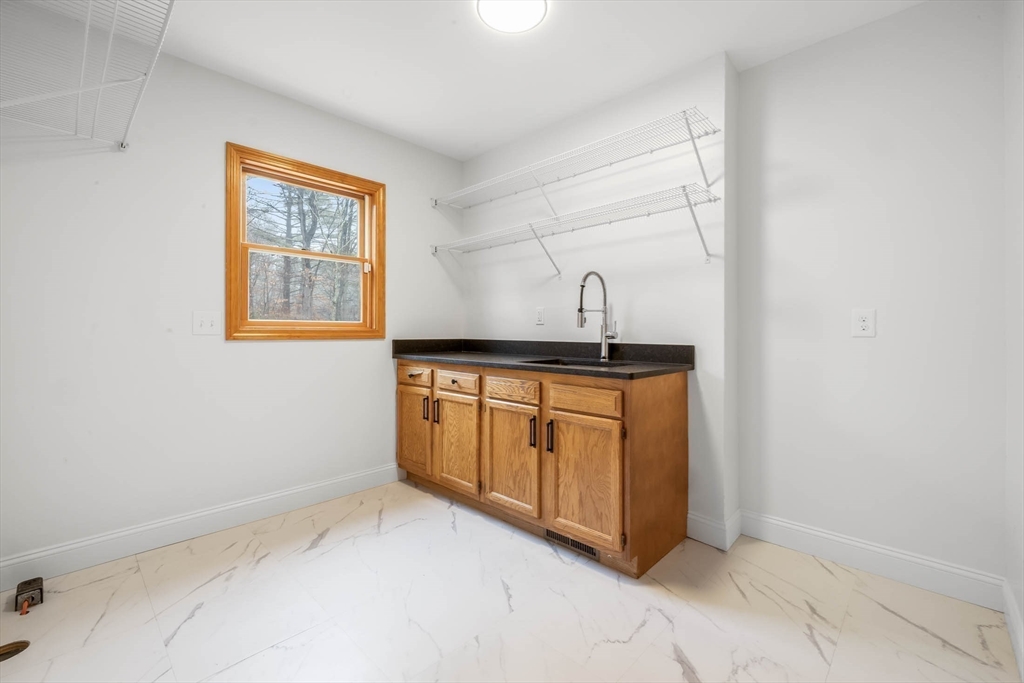 10 Alden Street Ludlow, MA 01056 - Photo 14 of 41 a kitchen with a sink and cabinets