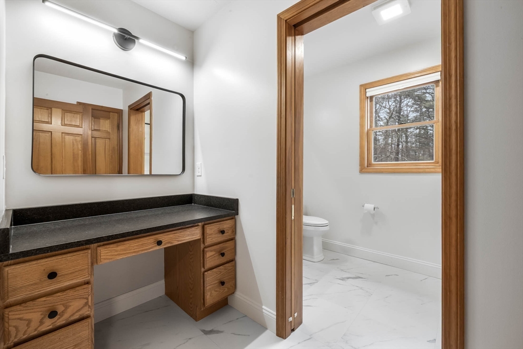 10 Alden Street Ludlow, MA 01056 - Photo 22 of 41 a bathroom with a granite countertop sink mirror and a toilet