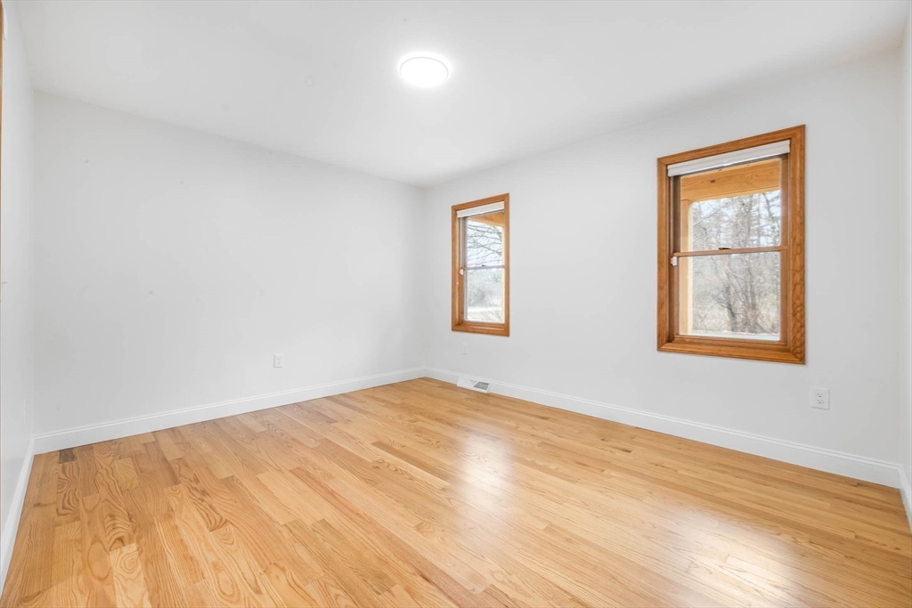 10 Alden Street Ludlow, MA 01056 - Photo 10 of 41 a view of empty room with wooden floor and fan