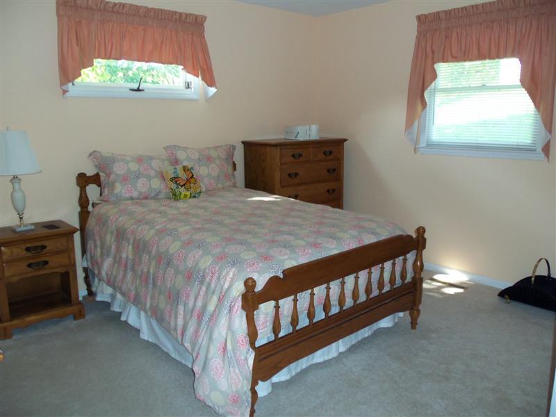 1219 Loggers Road Goodview, VA 24095 - Photo 6 of 21 a bedroom with a bed and a window