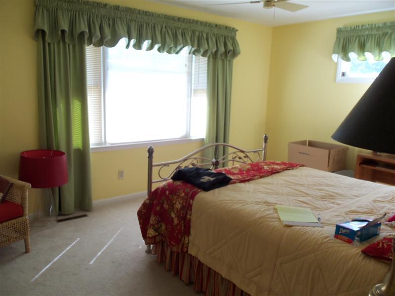 1219 Loggers Road Goodview, VA 24095 - Photo 7 of 21 a bedroom with a bed and window