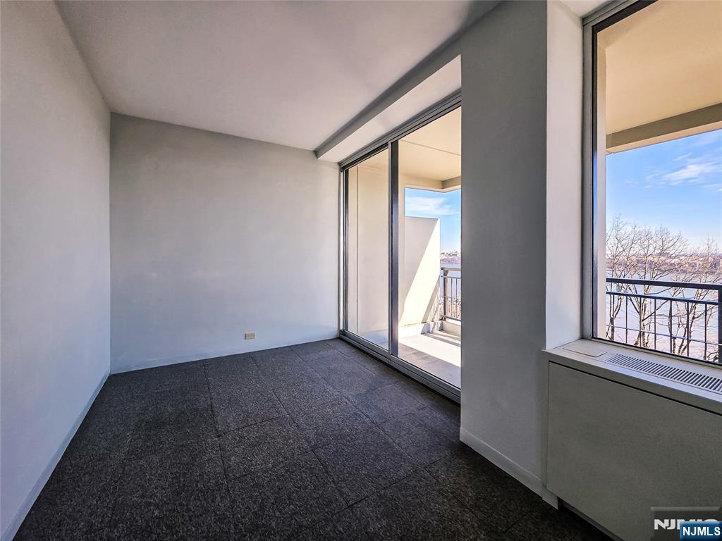 1 Horizon Road, Unit 811 Fort Lee, NJ 07024 - Photo 6 of 17 an empty room with a window