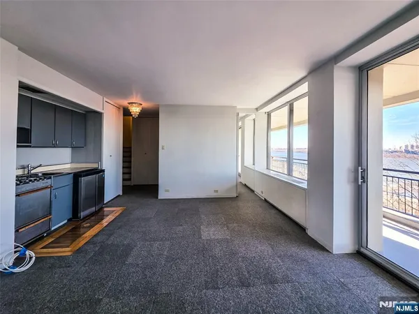 a view of a kitchen next to a window