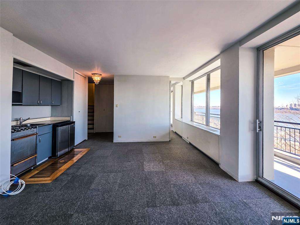 1 Horizon Road, Unit 811 Fort Lee, NJ 07024 - Photo 7 of 17 a view of a kitchen next to a window