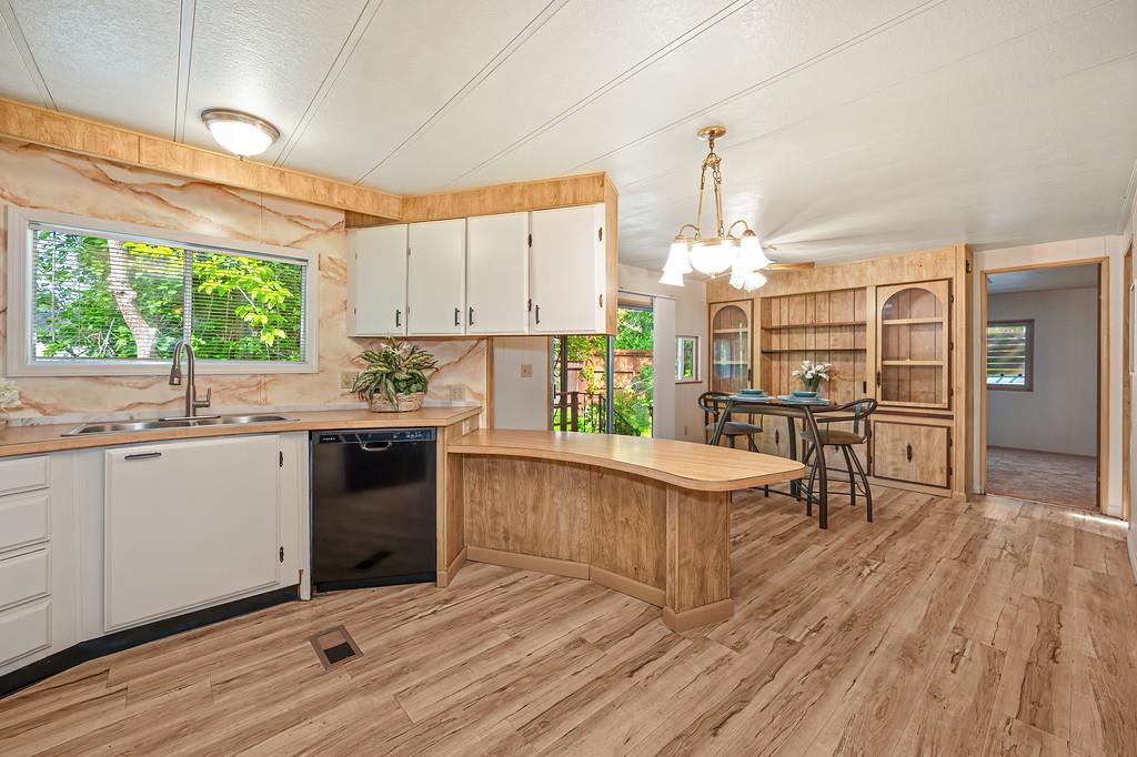 4800 Auburn Folsom Road, Unit 9 Loomis, CA 95650 - Photo 13 of 43 a kitchen with stainless steel appliances a stove a sink dishwasher and a refrigerator