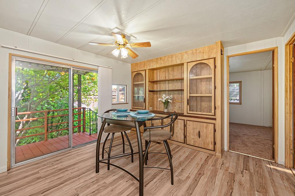 4800 Auburn Folsom Road, Unit 9 Loomis, CA 95650 - Photo 16 of 43 a view of a dining room with furniture window and wooden floor