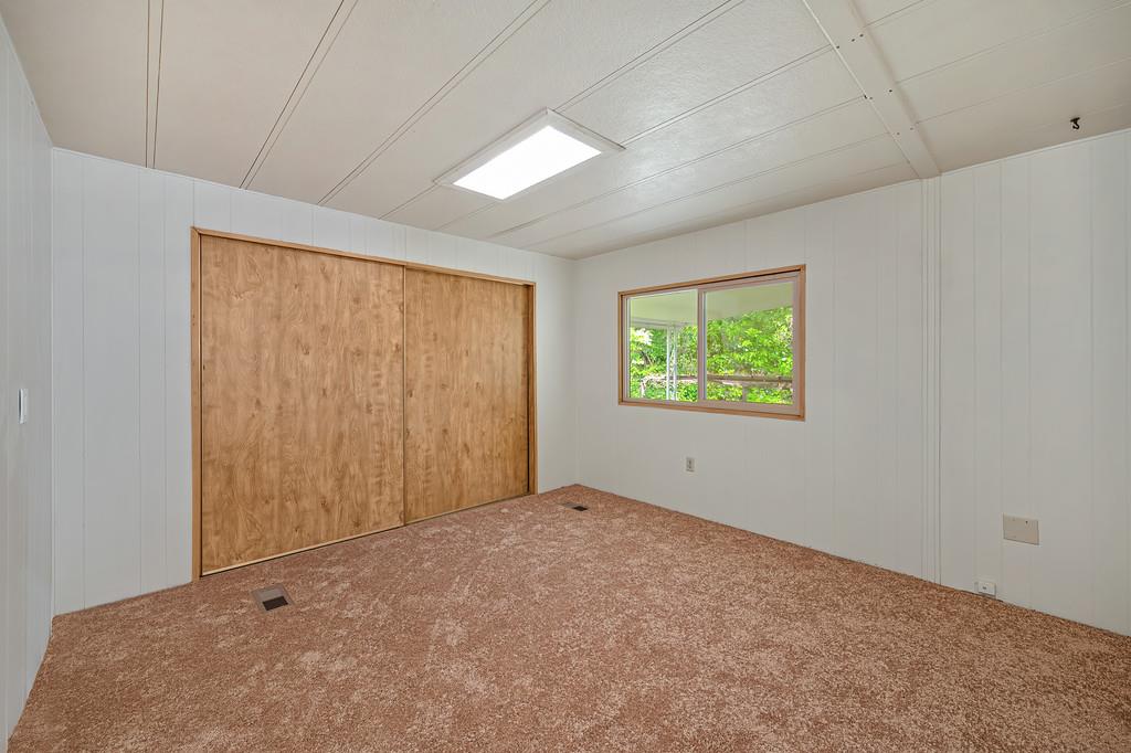 4800 Auburn Folsom Road, Unit 9 Loomis, CA 95650 - Photo 24 of 43 an empty room with windows