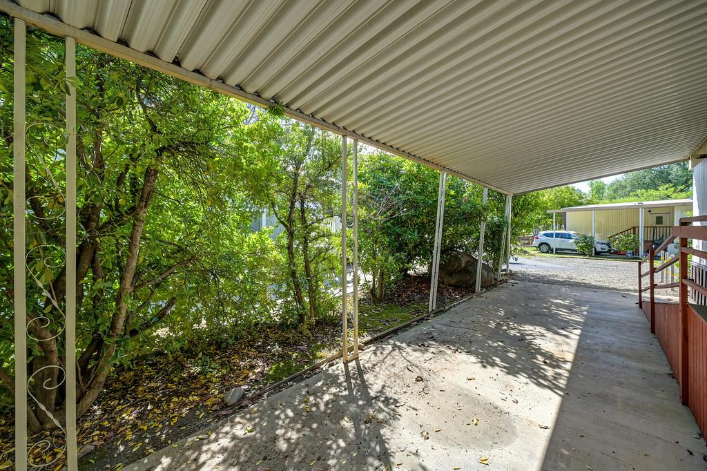 4800 Auburn Folsom Road, Unit 9 Loomis, CA 95650 - Photo 33 of 43 a view of a patio with table and chairs a barbeque with wooden fence and floor