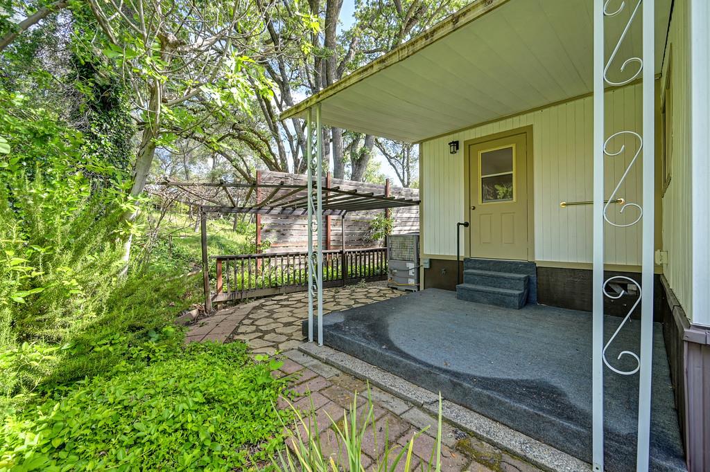4800 Auburn Folsom Road, Unit 9 Loomis, CA 95650 - Photo 36 of 43 a view of a house with a backyard