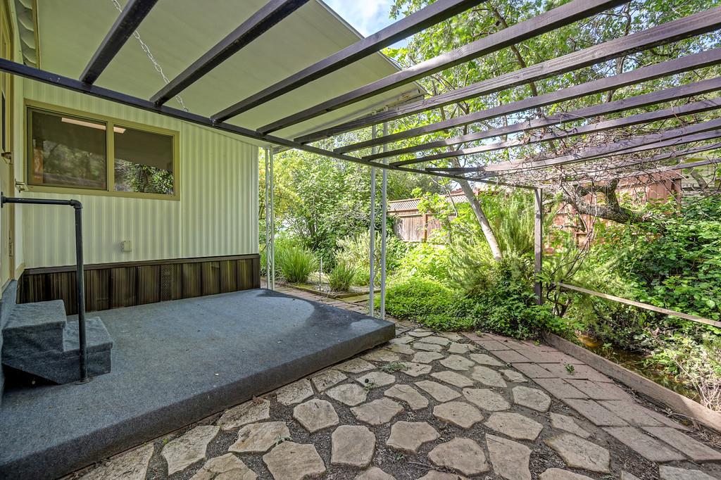 4800 Auburn Folsom Road, Unit 9 Loomis, CA 95650 - Photo 39 of 43 a view of backyard with plants and outdoor seating