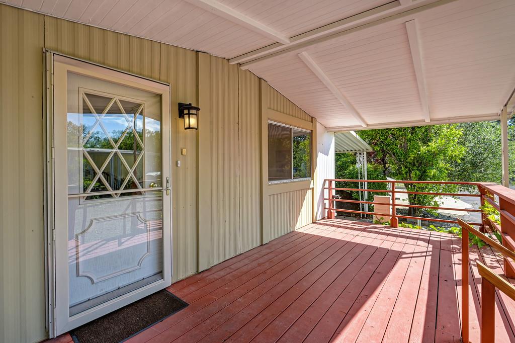 4800 Auburn Folsom Road, Unit 9 Loomis, CA 95650 - Photo 5 of 43 a view of a balcony with furniture and garden view
