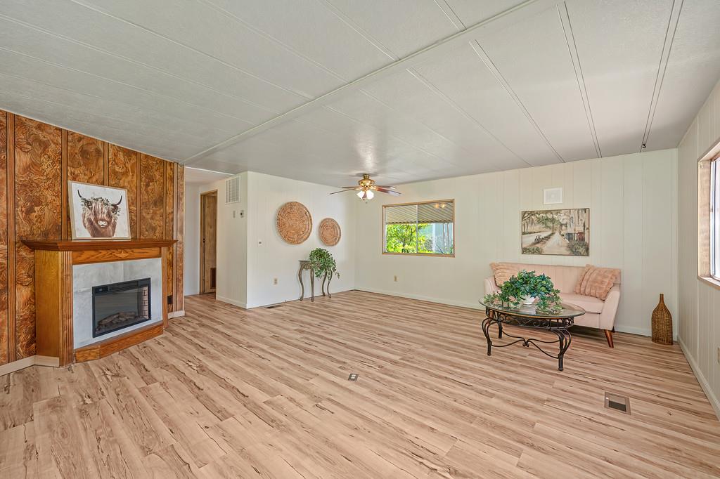 4800 Auburn Folsom Road, Unit 9 Loomis, CA 95650 - Photo 7 of 43 a bedroom with furniture and a fireplace