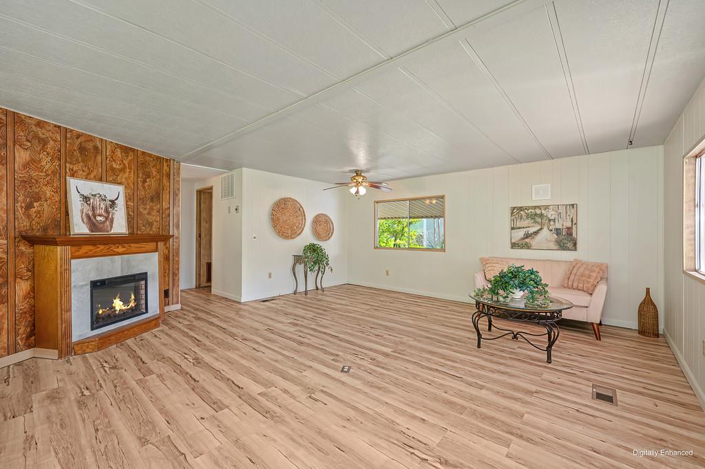 4800 Auburn Folsom Road, Unit 9 Loomis, CA 95650 - Photo 8 of 43 a bedroom with furniture and a fireplace