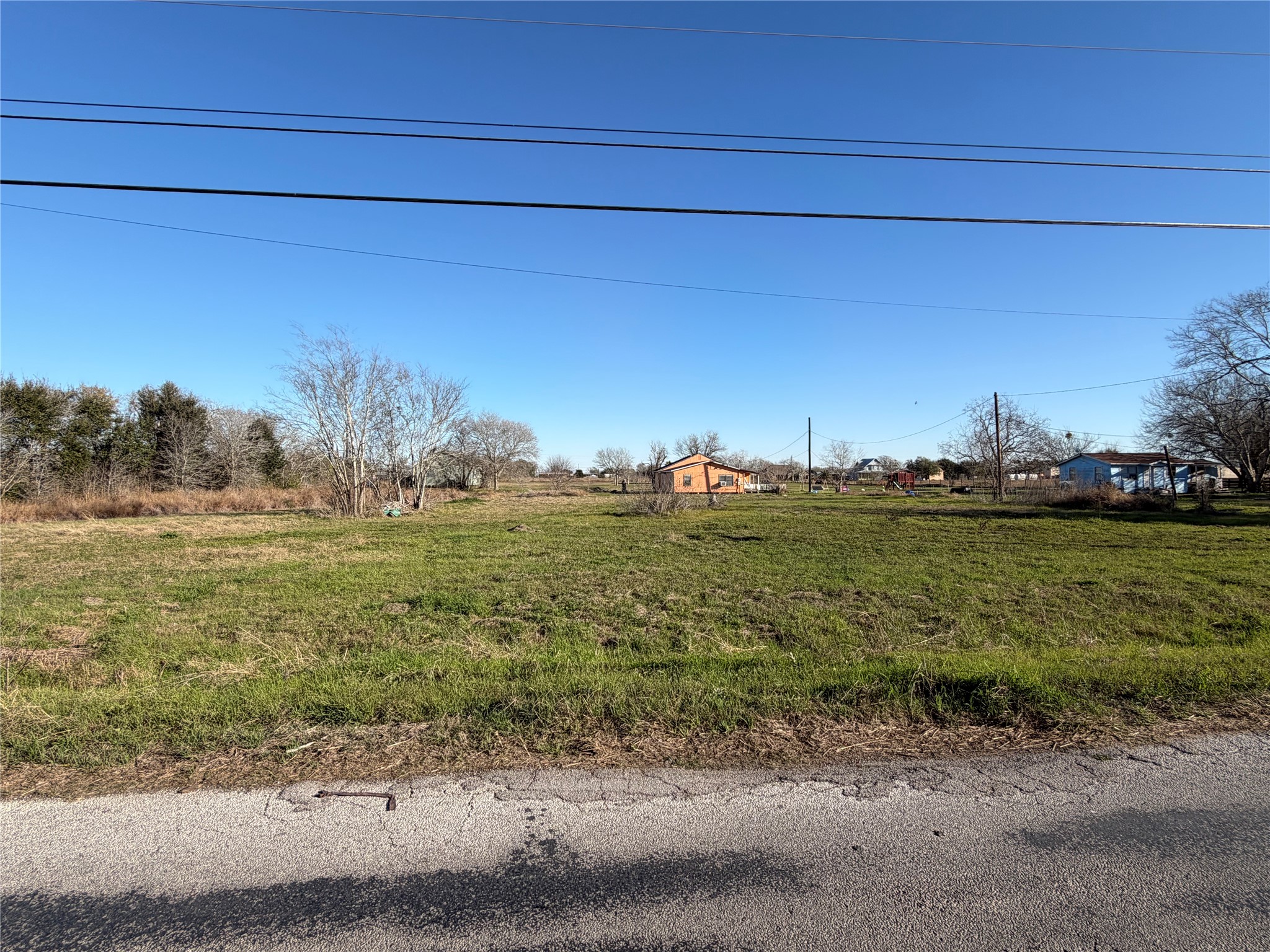 1508 Perryman Avenue Palacios, TX 77465 - Photo 5 of 5 a view of a field with an trees