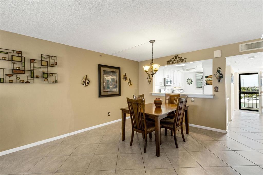 14900 Gulf Boulevard, Unit 410 Madeira Beach, FL 33708 - Photo 29 of 76 a view of a dining room with furniture
