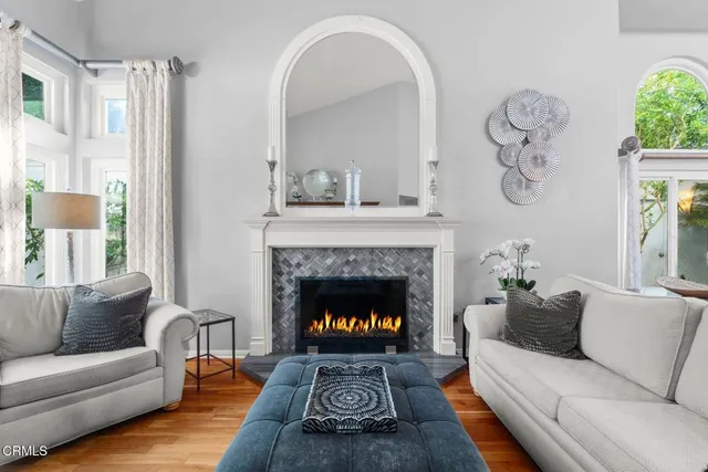 a living room with furniture and a fireplace