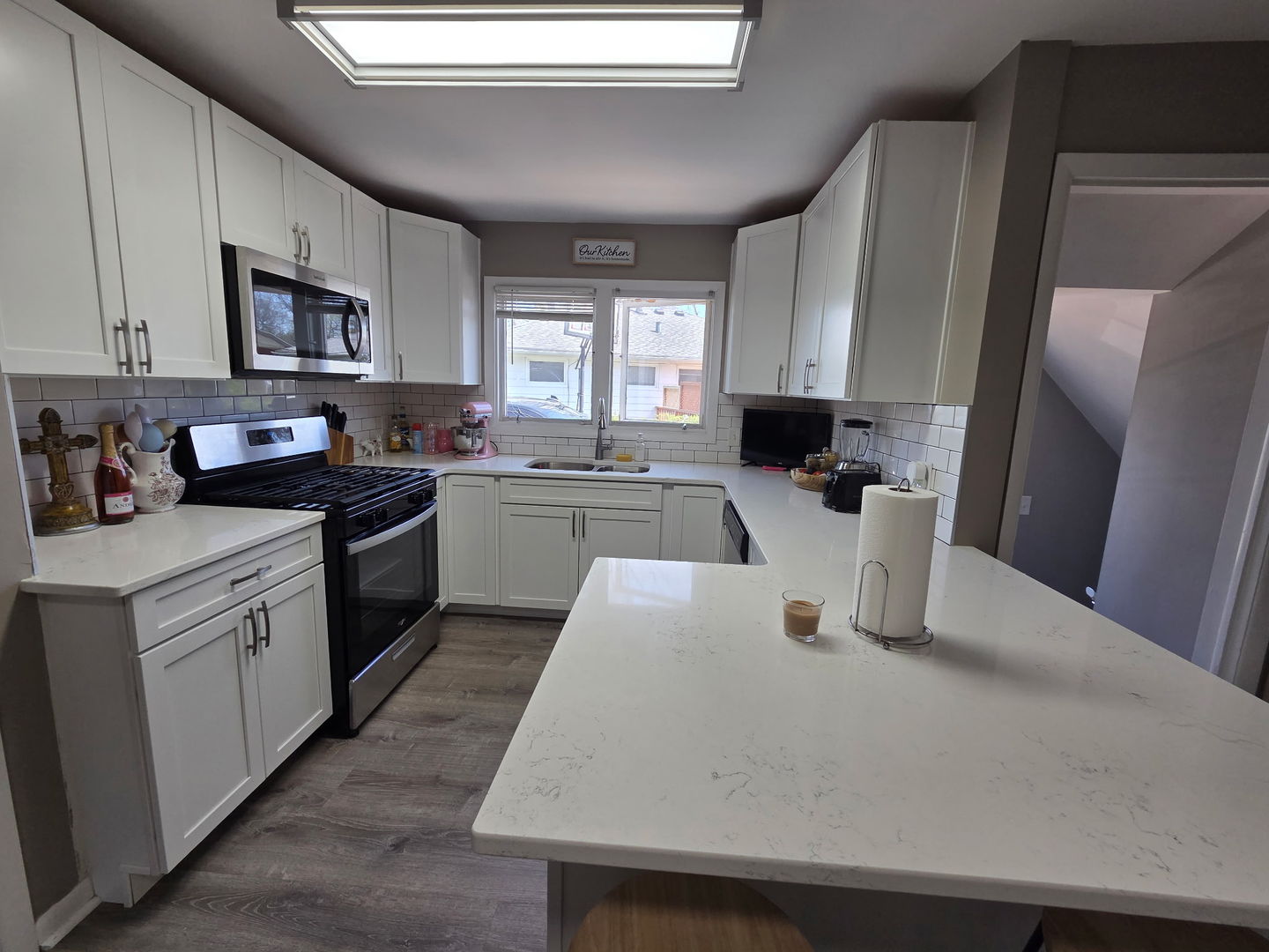 2550 26th Street Rock Island, IL 61201 - Photo 11 of 33 a kitchen with cabinets a sink a window and stainless steel appliances