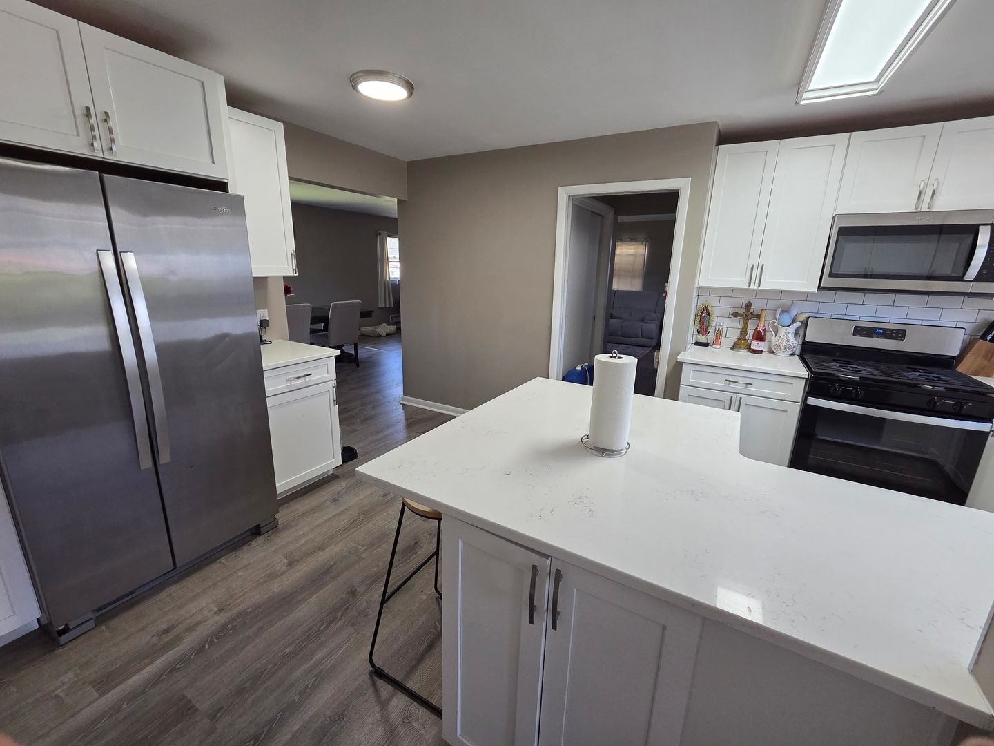 2550 26th Street Rock Island, IL 61201 - Photo 12 of 33 a kitchen with kitchen island a counter space a sink appliances and cabinets