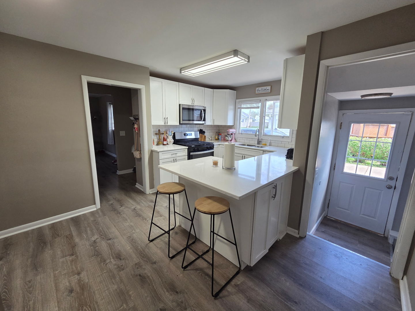2550 26th Street Rock Island, IL 61201 - Photo 13 of 33 a kitchen with a sink cabinets and wooden floor