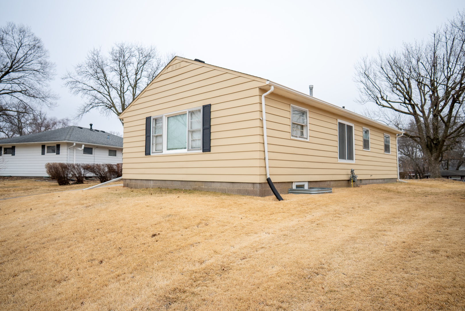 2550 26th Street Rock Island, IL 61201 - Photo 2 of 33 a view of a house with a snow in the yard