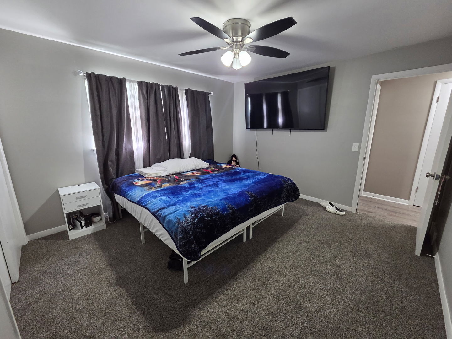 2550 26th Street Rock Island, IL 61201 - Photo 22 of 33 a bed sitting in a spacious bedroom next to a window