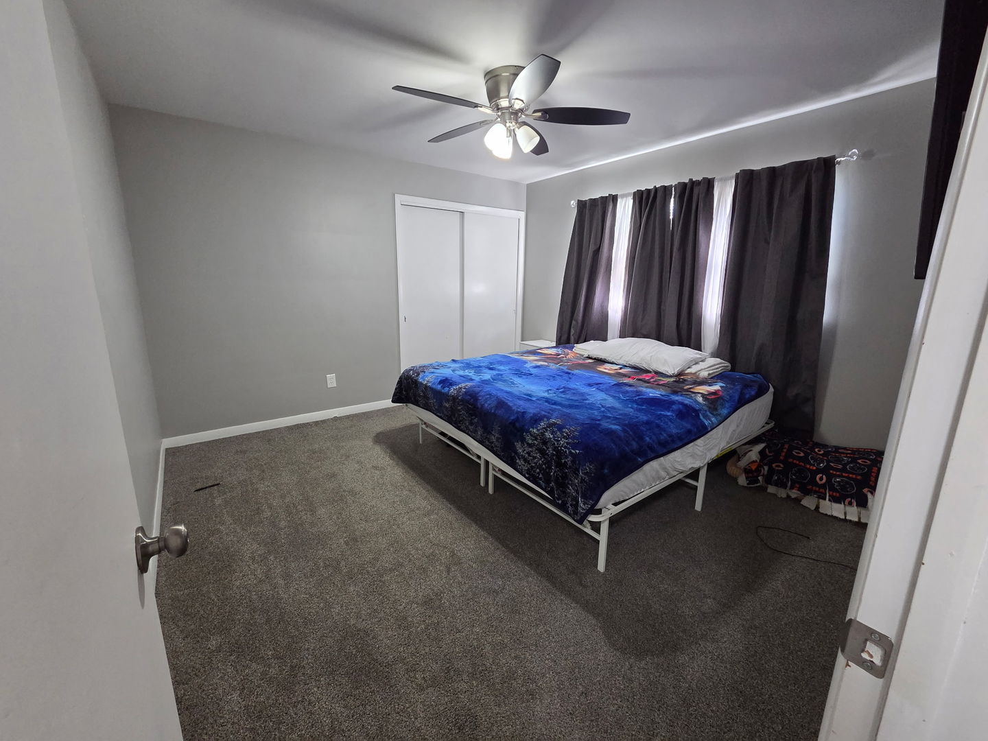 2550 26th Street Rock Island, IL 61201 - Photo 23 of 33 a bed sitting in a room next to a window