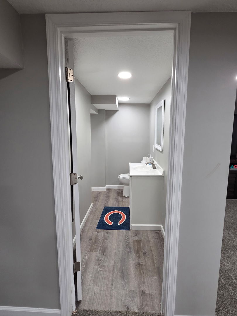 2550 26th Street Rock Island, IL 61201 - Photo 28 of 33 a bathroom with a sink and a mirror