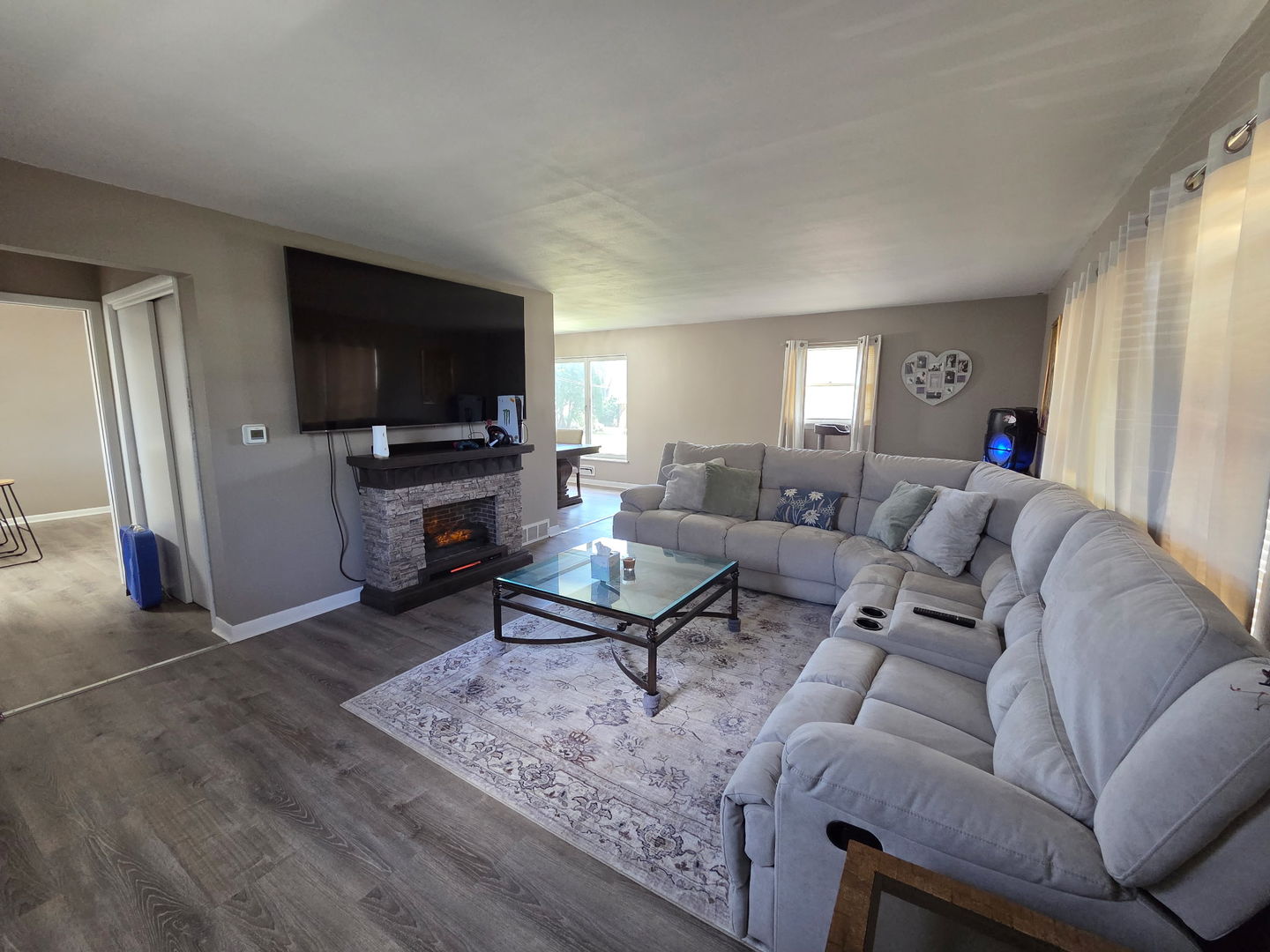 2550 26th Street Rock Island, IL 61201 - Photo 5 of 33 a living room with furniture a flat screen tv and a refrigerator