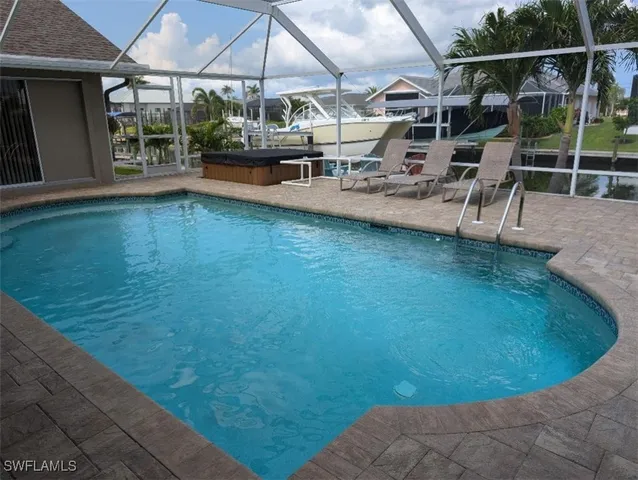 a view of a swimming pool with a porch