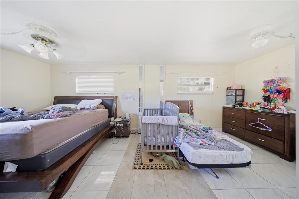 213 South 3rd Street Lake Mary, FL 32746 - Photo 12 of 30 a bedroom with a bed and furniture