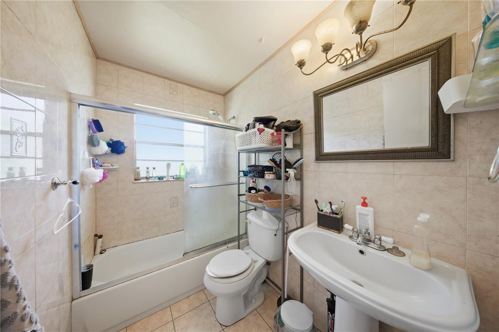 213 South 3rd Street Lake Mary, FL 32746 - Photo 15 of 30 a bathroom with a sink toilet and shower