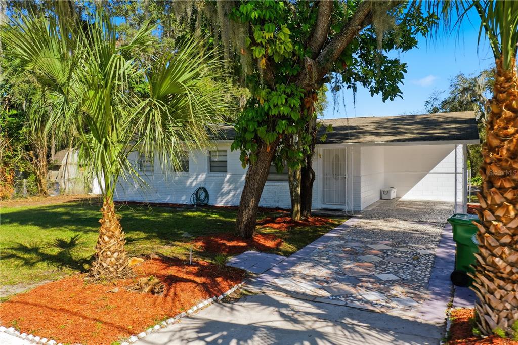 213 South 3rd Street Lake Mary, FL 32746 - Photo 2 of 30 a view of a backyard with floor to ceiling window and tree