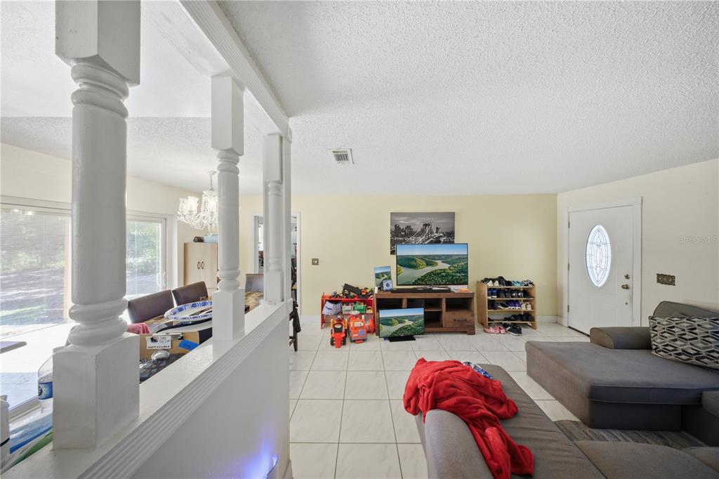 213 South 3rd Street Lake Mary, FL 32746 - Photo 5 of 30 a living room with furniture and a table