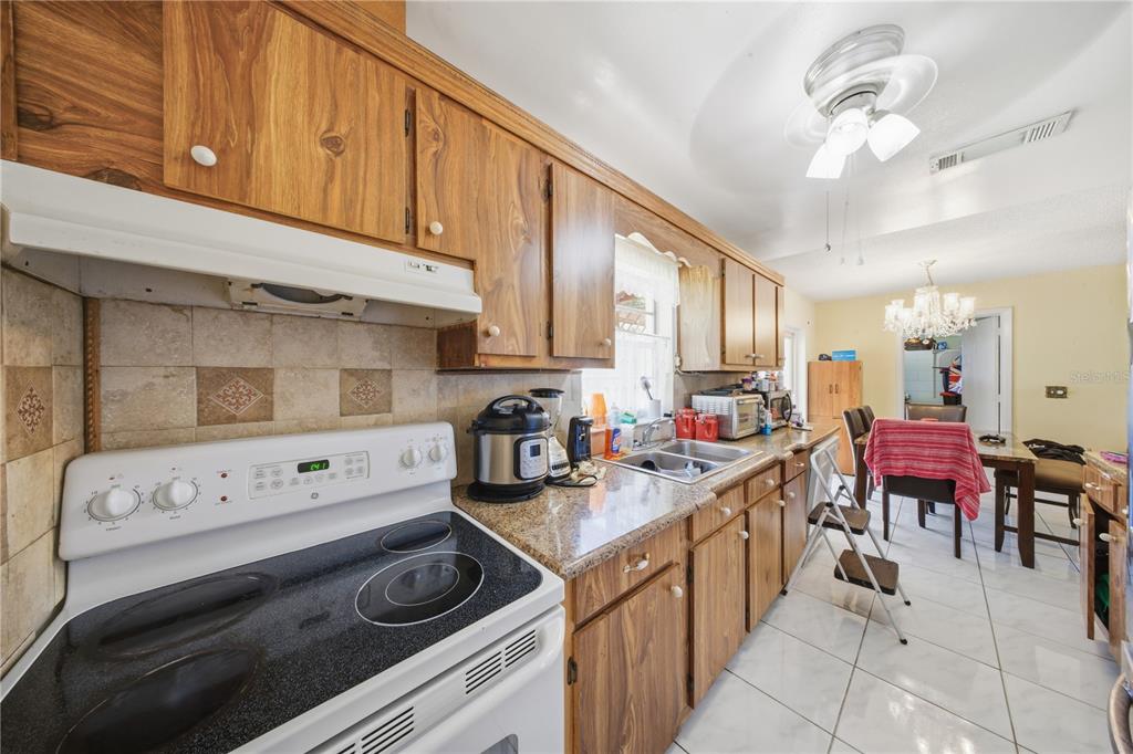 213 South 3rd Street Lake Mary, FL 32746 - Photo 10 of 30 a kitchen with appliances a stove and cabinets
