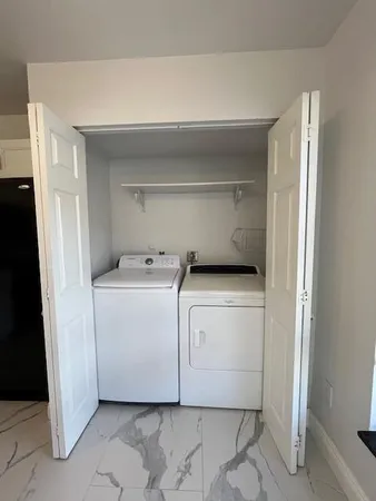 a bathroom with a double vanity sink and mirror