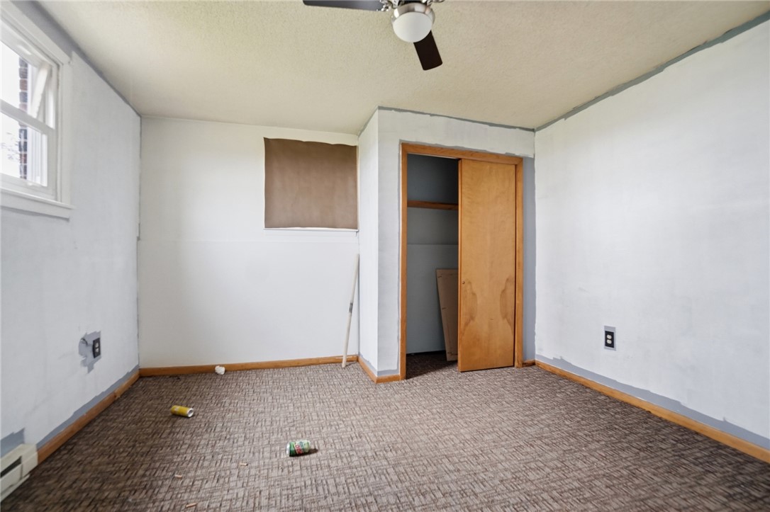 9750 Middlepoint Road Middle Point, OH 45863 - Photo 30 of 43 This spacious room offers potential for personalization and comfort with a ceiling fan and ample natural light.