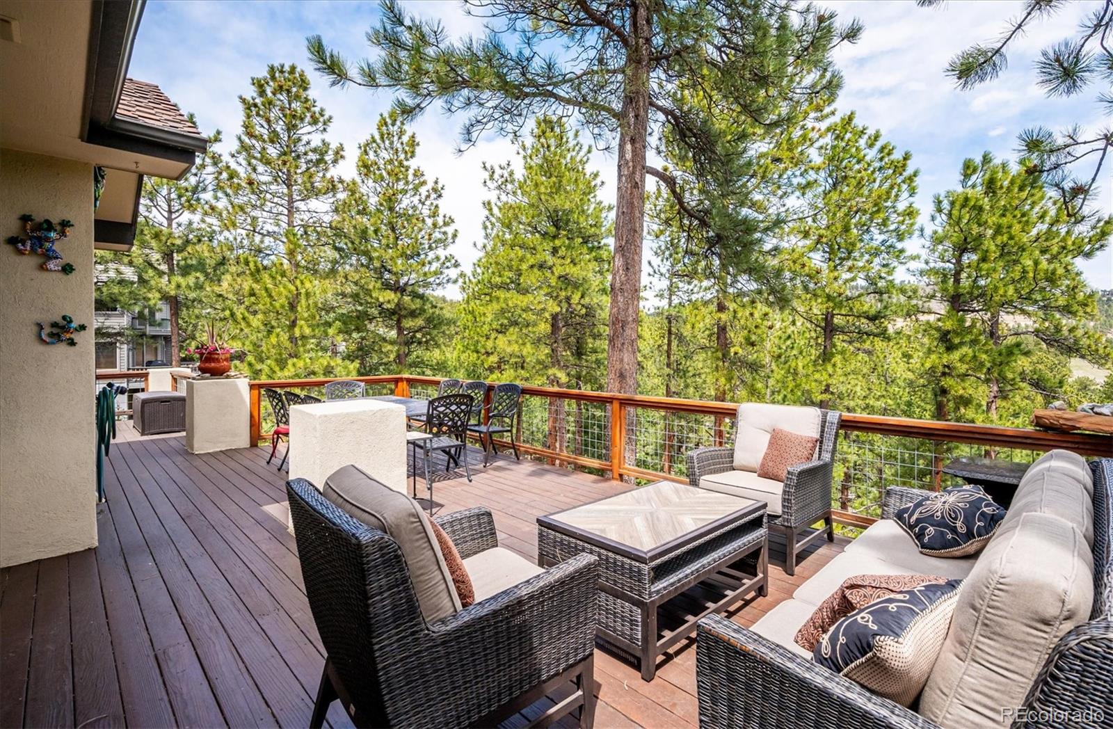1784 Prima Lane Evergreen, CO 80439 - Photo 17 of 37 a balcony with furniture and wooden floor