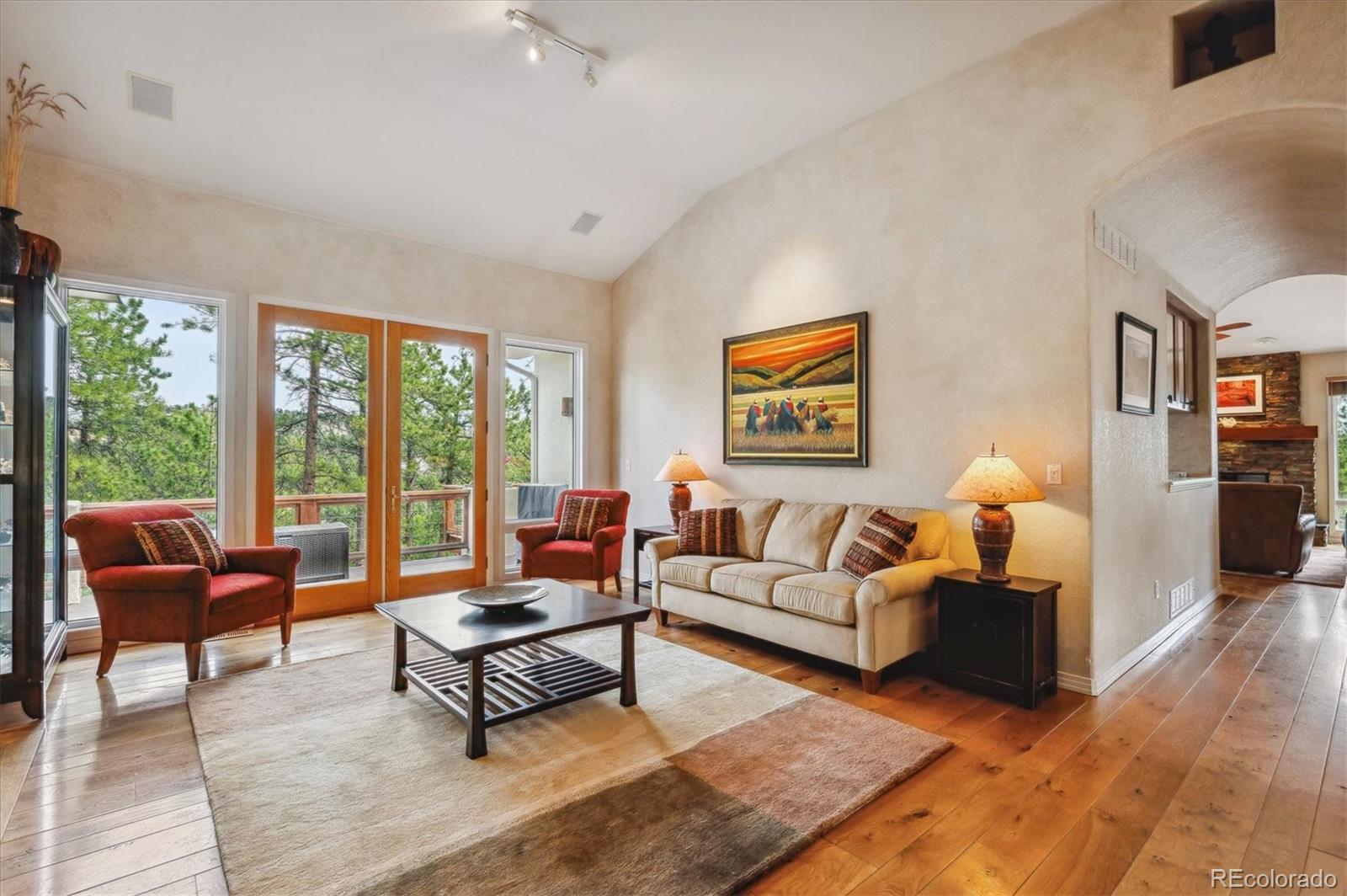 1784 Prima Lane Evergreen, CO 80439 - Photo 5 of 37 a living room with furniture and a large window