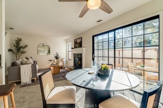 a dining room with furniture and window