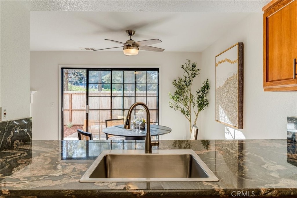 646 Shady Lane Santa Maria, CA 93455 - Photo 16 of 44 a kitchen with a sink a counter top space and living room view