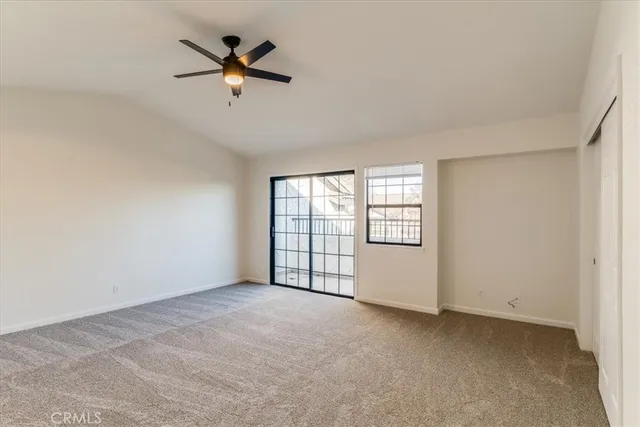 a spacious bathroom with a granite countertop sink and a mirror