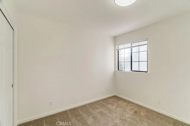 a building outdoor space with patio furniture and potted plants