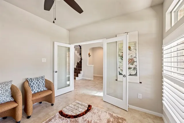 a living room with furniture and a window