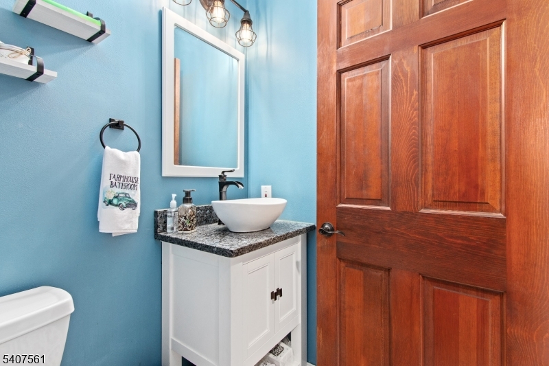 30 Lanning Road Blairstown, NJ 07825 - Photo 13 of 40 a bathroom with a granite countertop sink and a mirror